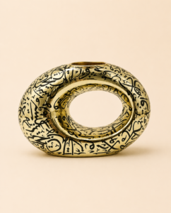 Luxury golden bakhoor stand with black Arabic calligraphy by Arafaan